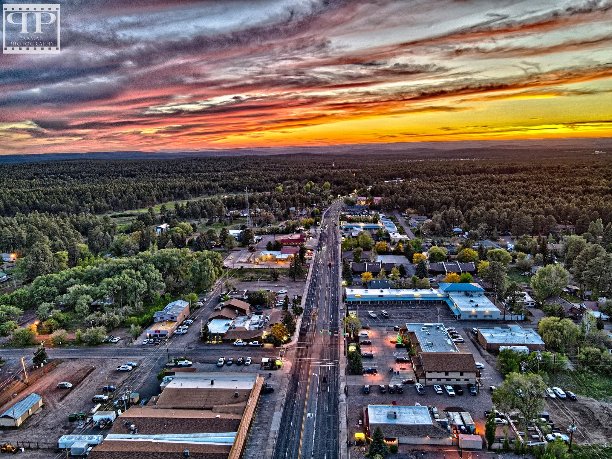 Aerial view of White Mountain Boulevard through Pinetop at sunset.